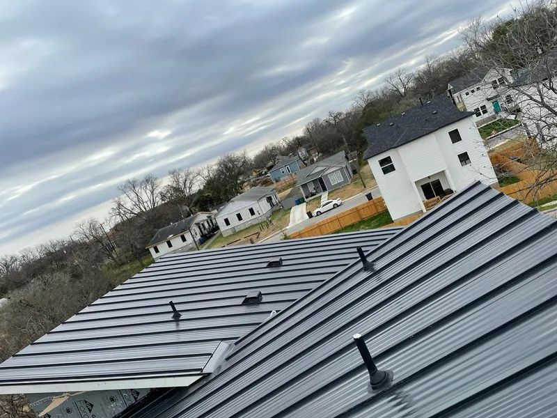 Standing seam metal roof panels with vents for Skylight Repair in Keller